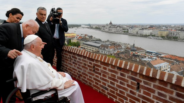 Pope Francis overlooking the city with Hungary's President Katalin Novak and Hungary's Prime Minister Viktor Orban after a meeting with the authorities
