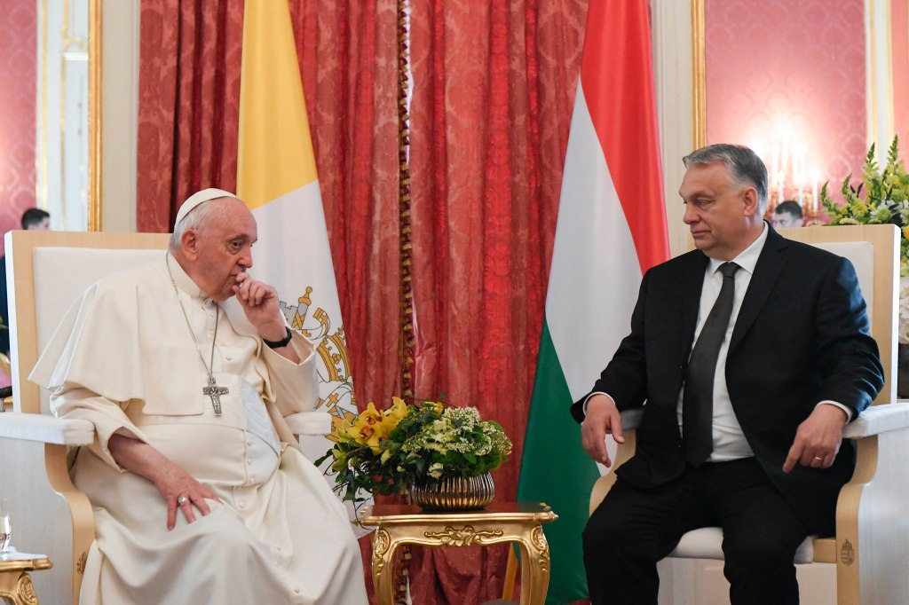 Pope Francis talking to Hungary's Prime Minister Viktor Orban in the Sandor Palace in Budapest on April 28, 2023