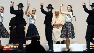 Pope Francis watches a dance performance as he meets with young people at Papp Laszlo Sportarena during his visit in Budapest, Hungary