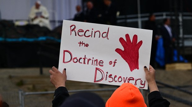 Protesting at papal Mass in Canada against doctrine of discovery