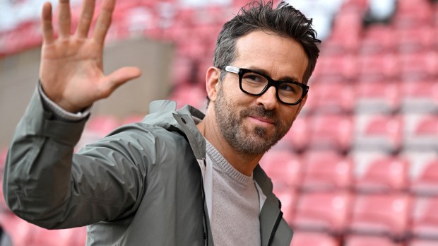 US actor and Wrexham owner Ryan Reynolds waves to fans ahead of the English FA Cup fourth round football match
