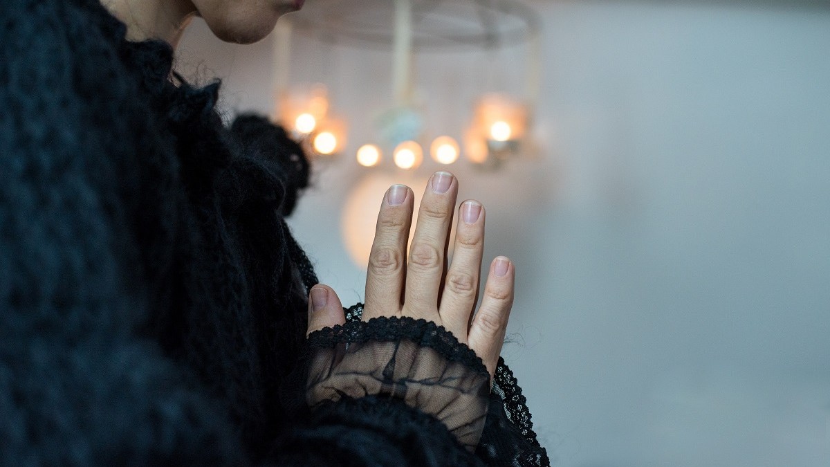 Woman praying silently, smiling