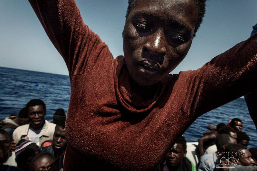 A migrant woman on a boat in the Mediterranean Sea
