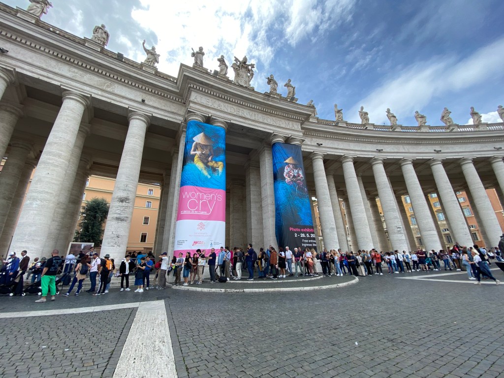 The entrance of the photo exhibit "Women's Cry" on St. Peter's Square