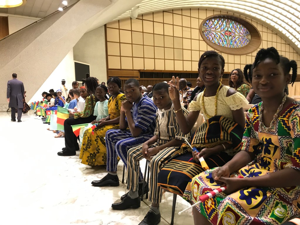 Children from various African countries wait to meet Pope Francis during an audience at the Paul VI Audience Hall
