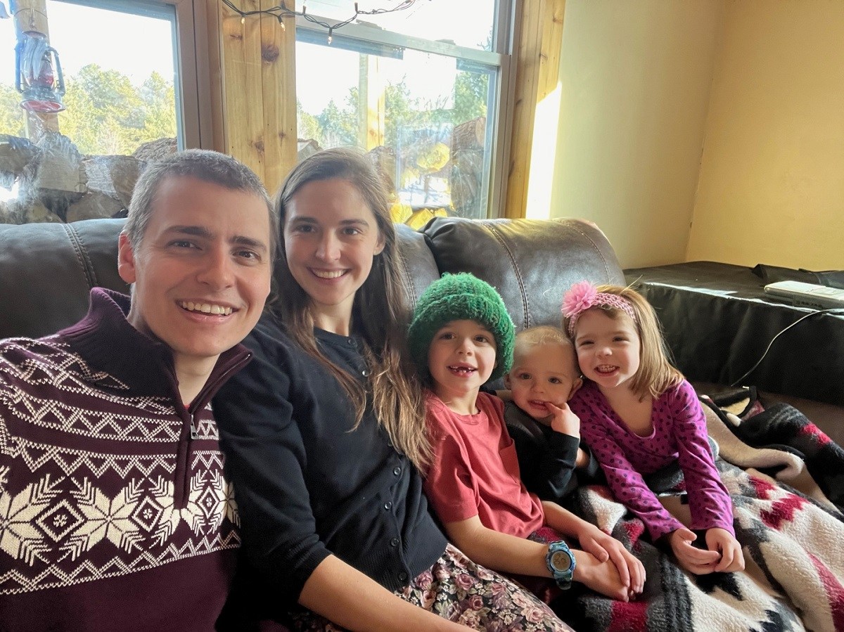 Jacob Rudd, family together on couch