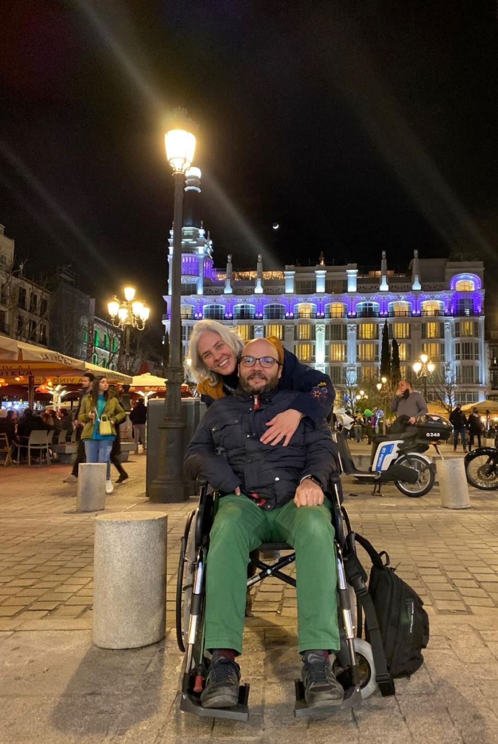 David Rodríguez Nieto seated in a wheelchair next to his wife