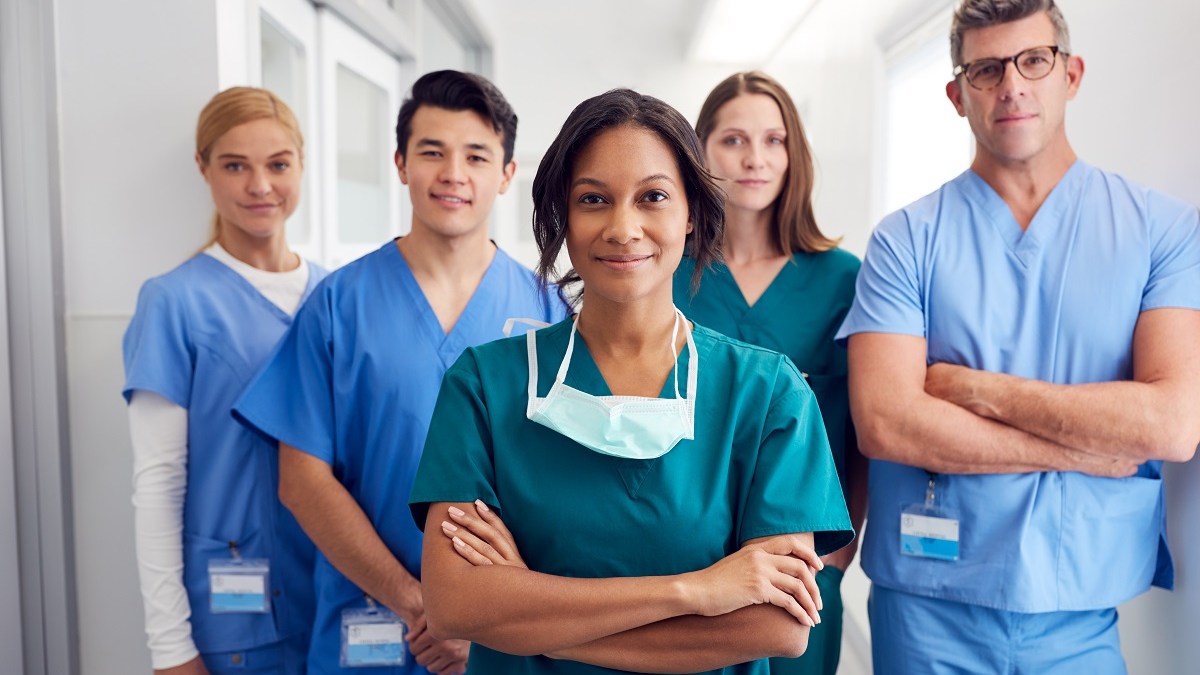 nurses standing and smiling