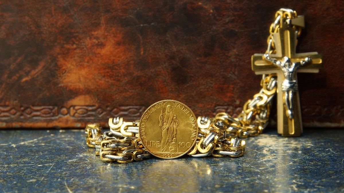 Crucifix and coin