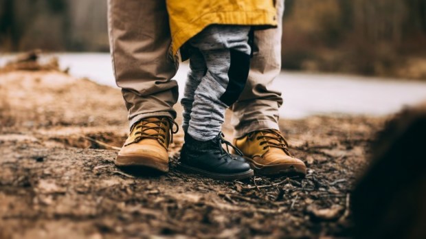 father son feet forest