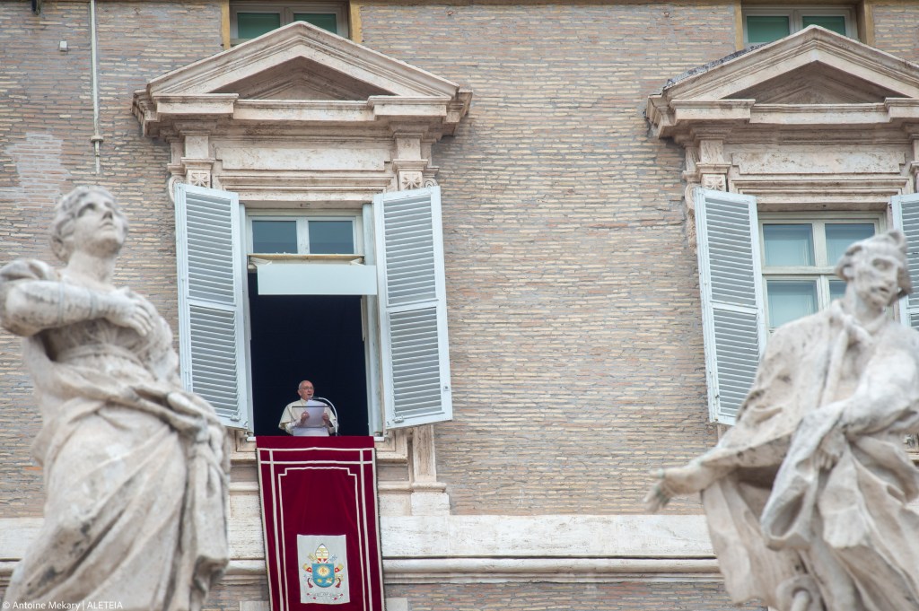 Pope Francis addresses worshippers during his Angelus prayer from the window of the Apostolic Palace