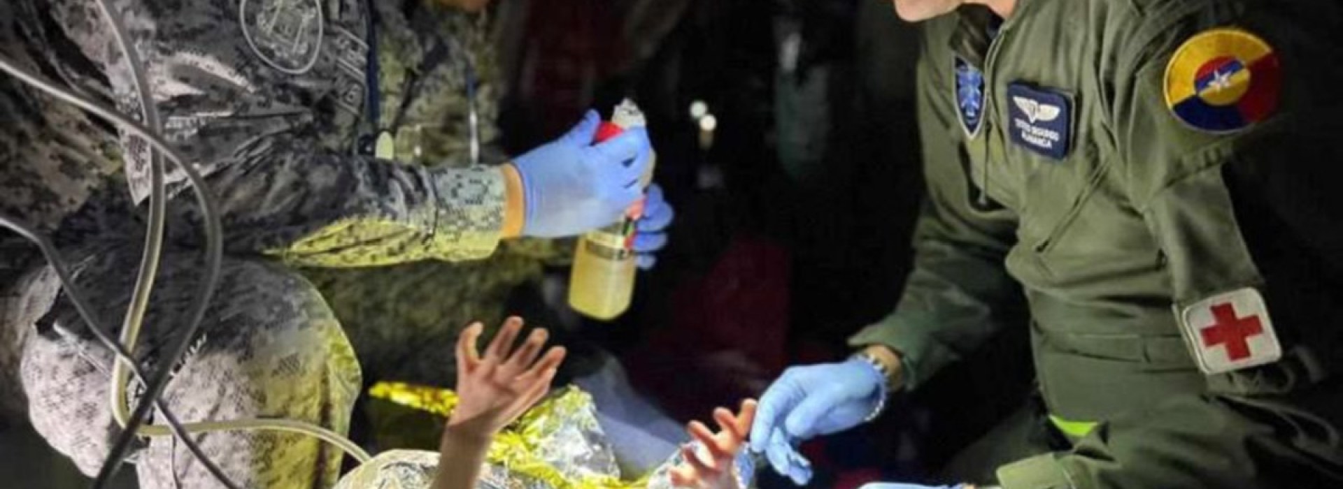 Rescuers give medical attention to child rescued from Amazon jungle