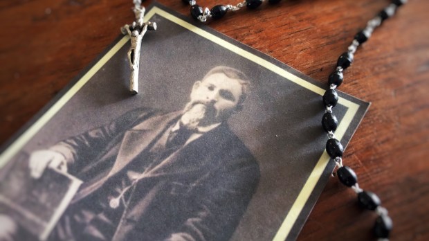 St. Jose Isabel Flores photo on table with rosary