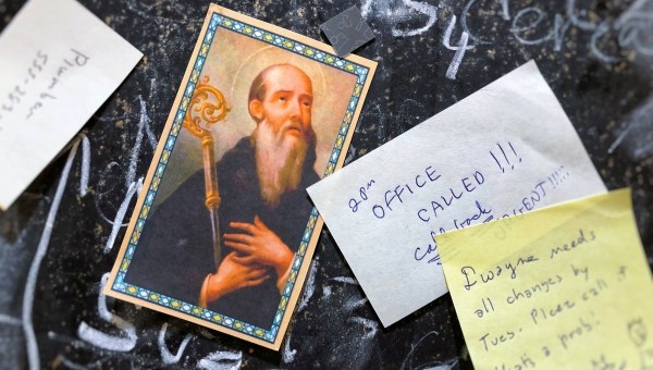 St. Benedict card on home message board