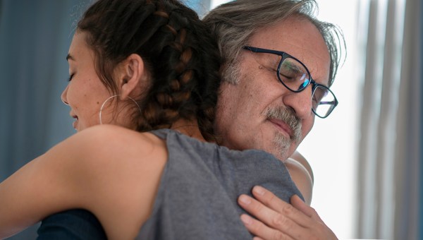 father daughter hug adult woman man