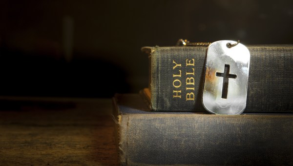 cross in military tag, bible