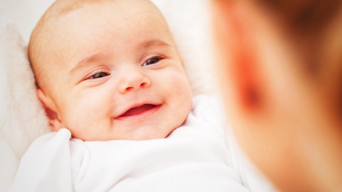 Baby smiling at mom