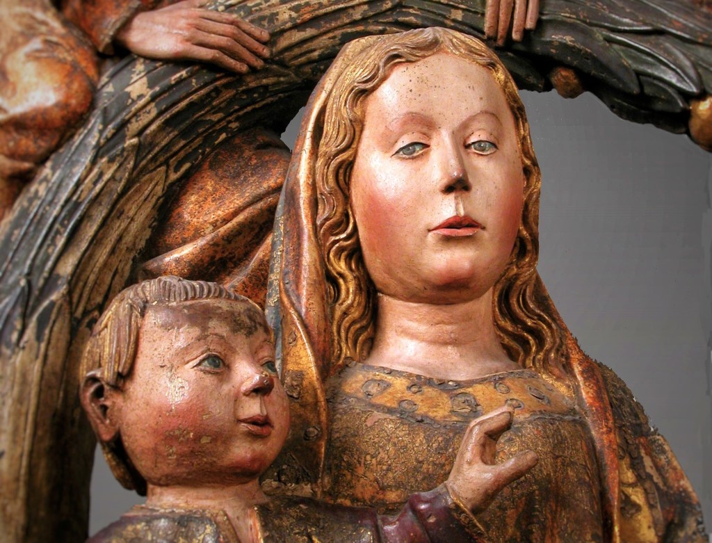 Wooden sculpture of Holy Family under palm tree, detail