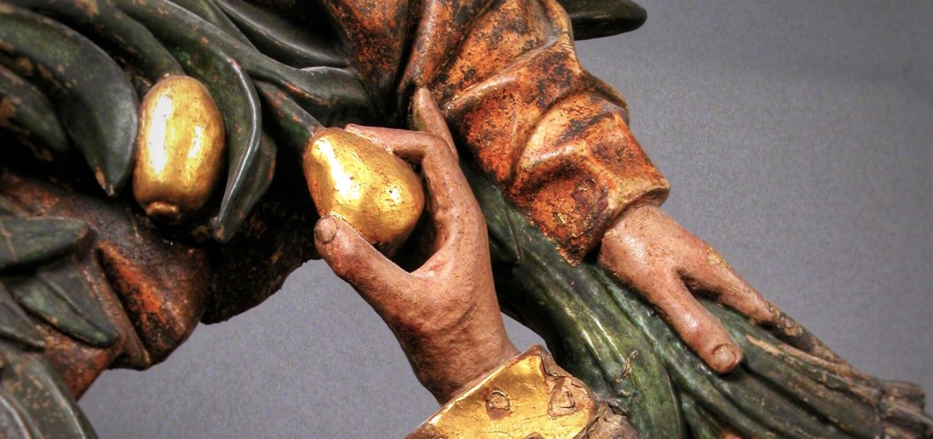 Wooden sculpture of Holy Family under palm tree, detail