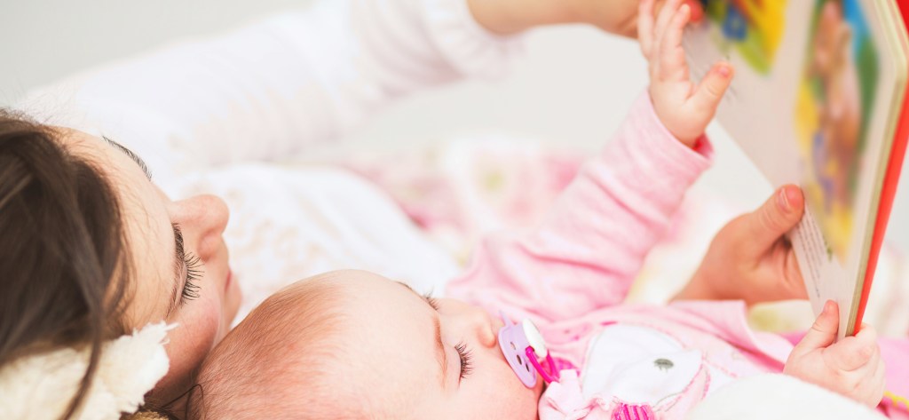 Mom reading to baby