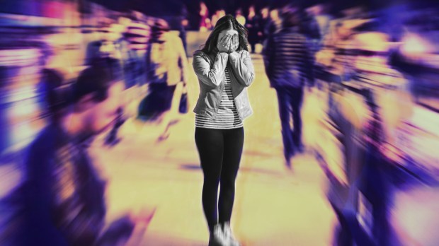 woman in crowd with anxiety