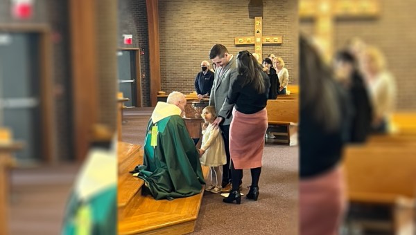 A-priest-talks-to-a-little-girl-photo-courtesy-Father-Gregory-Malovetz