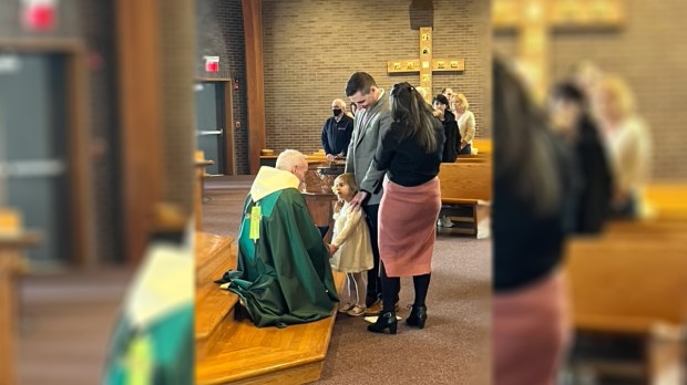 A-priest-talks-to-a-little-girl-photo-courtesy-Father-Gregory-Malovetz