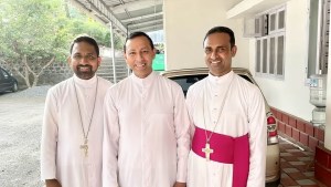 Bishop John Nellikunnel (left) and Bishop Mathew Nellikunnel (right) with the priest of St. Mary's parish in Mariyapuram