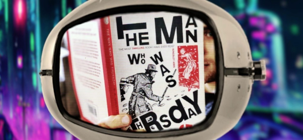 Retro futuristic TV showing man reading "The Man Who Was Thursday" by Chesterton