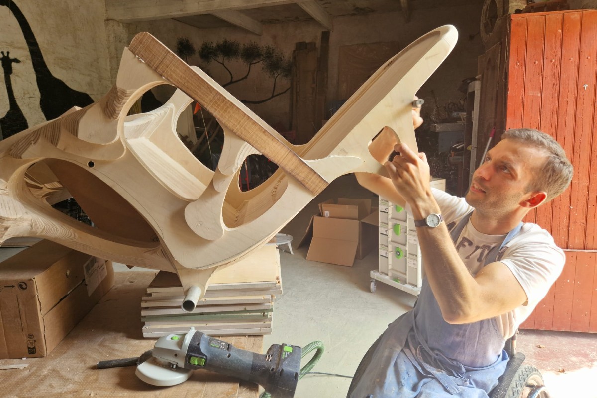 Paul de Livron working on a wooden wheelchair for Pope Francis