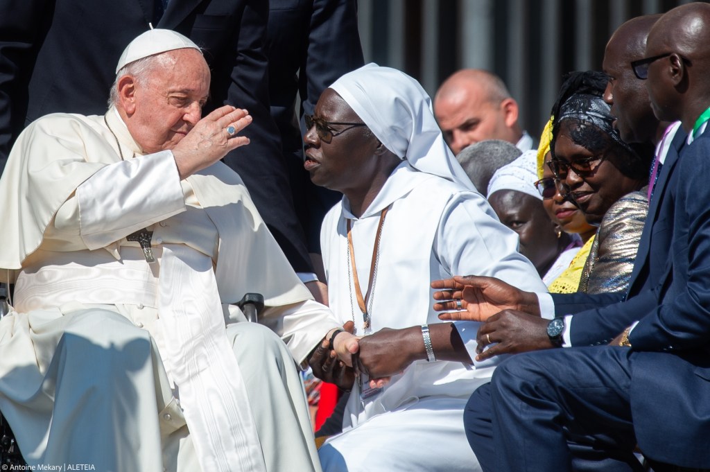 Pope Francis blesses a nun from senegal