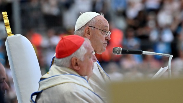 Pope Francis waves as he arrives to celebrate mass at the Velodrome stadium in the southern port city of Marseille