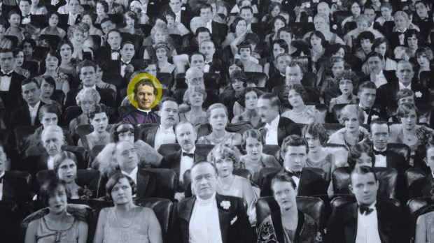 Black and white photo of crowded theater with St. John Bosco inserted in color with serene smile.