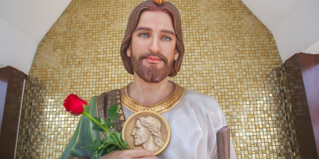Why does St. Jude hold a medallion in paintings and statues?
