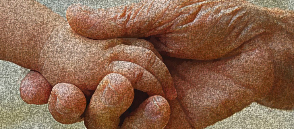 Elderly person holds childs hand