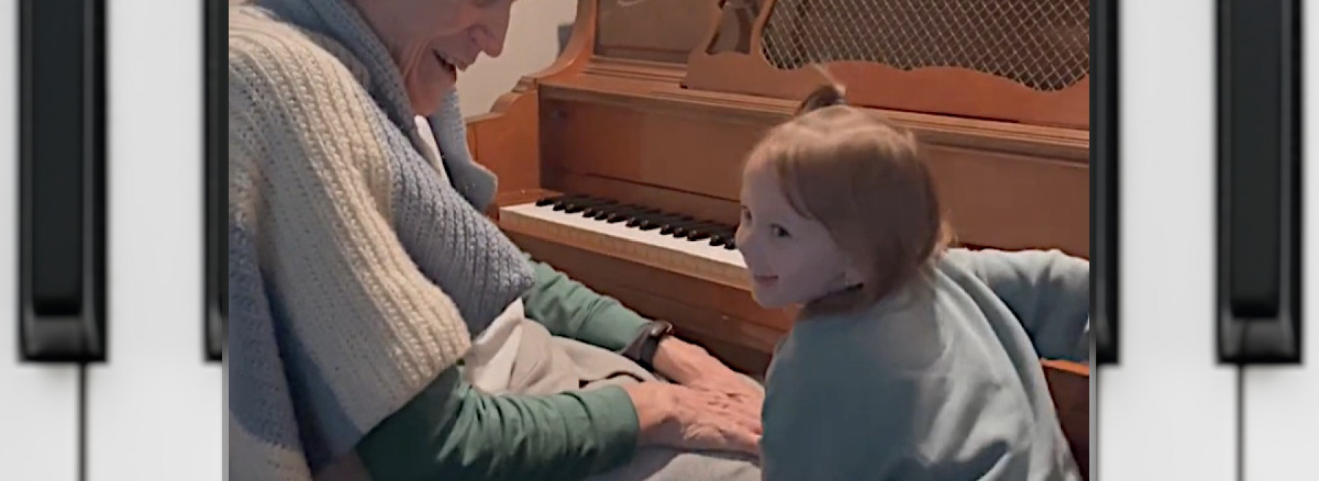 Harold Chilton at the piano with his grandaughter, age 3.