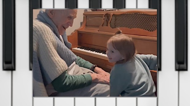 Harold Chilton at the piano with his grandaughter, age 3.