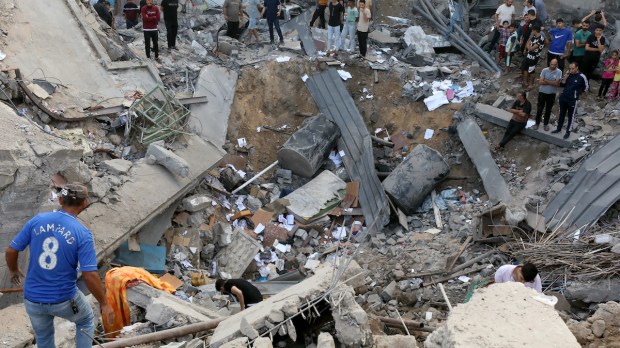 Rescuers search rubble at Orthodox Church in Gaza