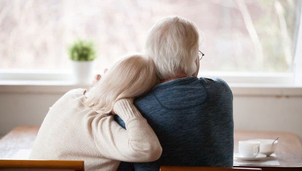 OLD-PEOPLE-COUPLE-WINDOW-shutterstock_1185179302