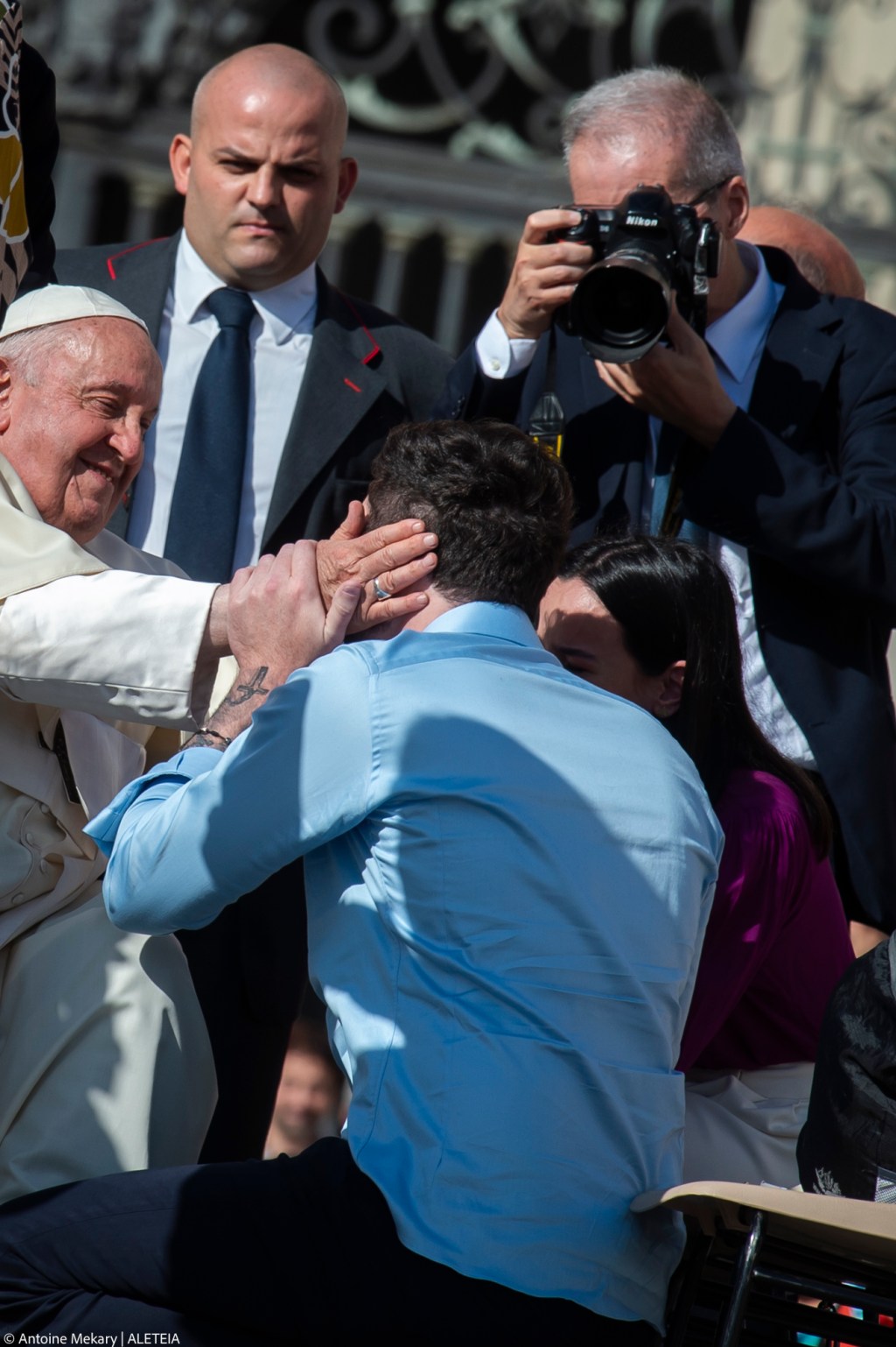 Pope Francis blesses a couple at the conclusion of his weekly general audience.