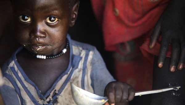 Boy in South Sudan gets food