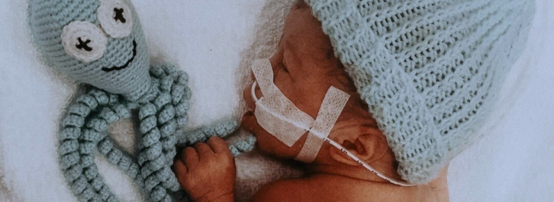 Preemie baby with knit octopus