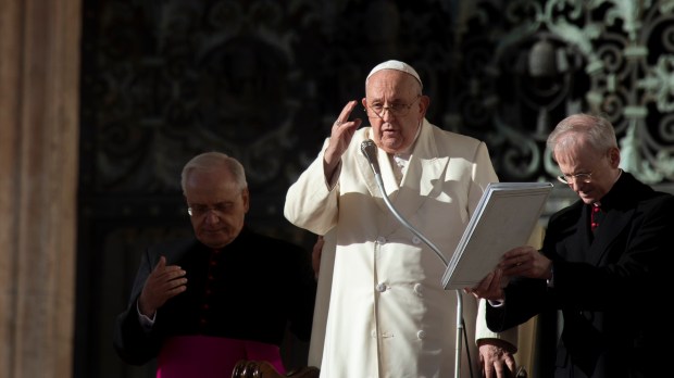 Pope Francis blesses faithful at the end of his weekly general audience in Saint Peter's square at the Vatican