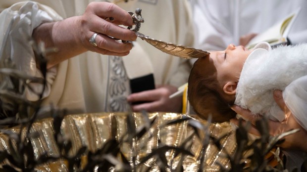 Pope Francis Newborn baby head baptism