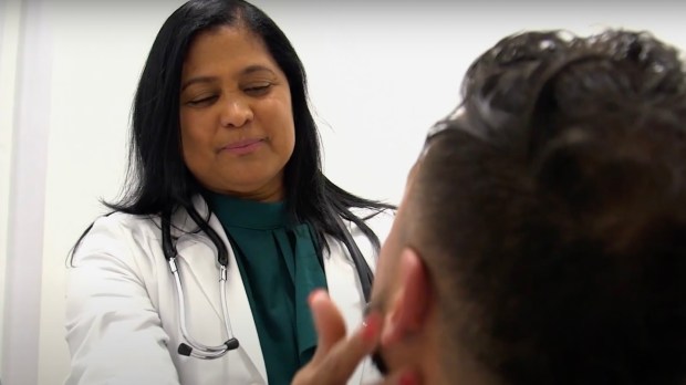 doctor exam woman Latino