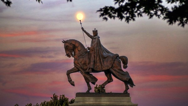 The moon over the Apotheosis of St. Louis statue of King Louis IX of France, namesake of St. Louis, Missouri in Forest Park, St. Louis, Missouri