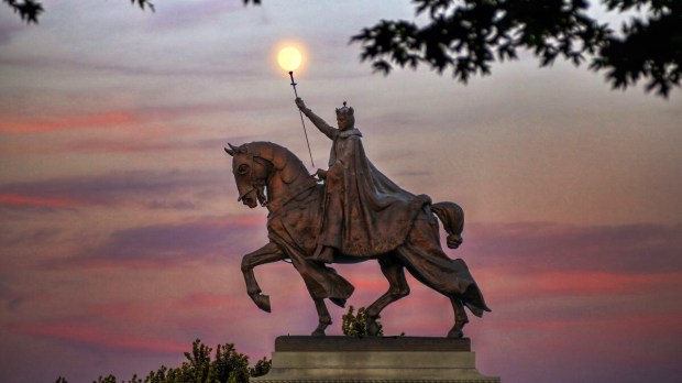 The moon over the Apotheosis of St. Louis statue of King Louis IX of France, namesake of St. Louis, Missouri in Forest Park, St. Louis, Missouri