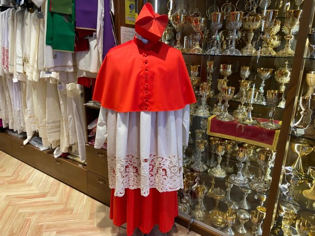 A cardinal's uniform on display at Mancinelli Clero, Rome
