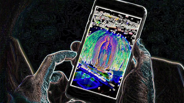 Digitized vision of Our Lady of Guadalupe on phone