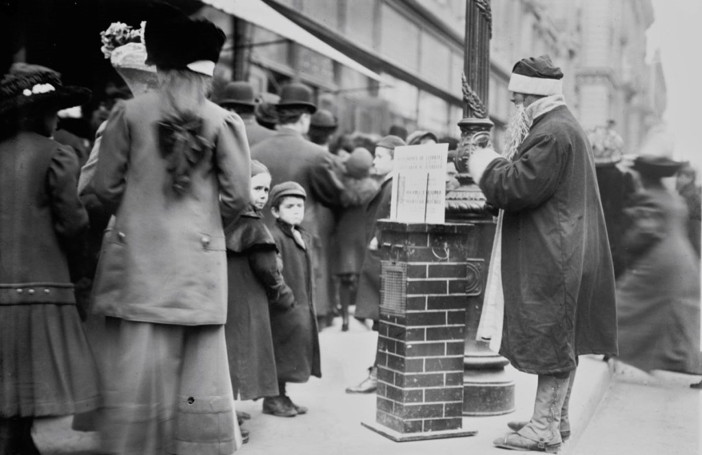 Old photo of "Santa" collecting money for charity on a city street